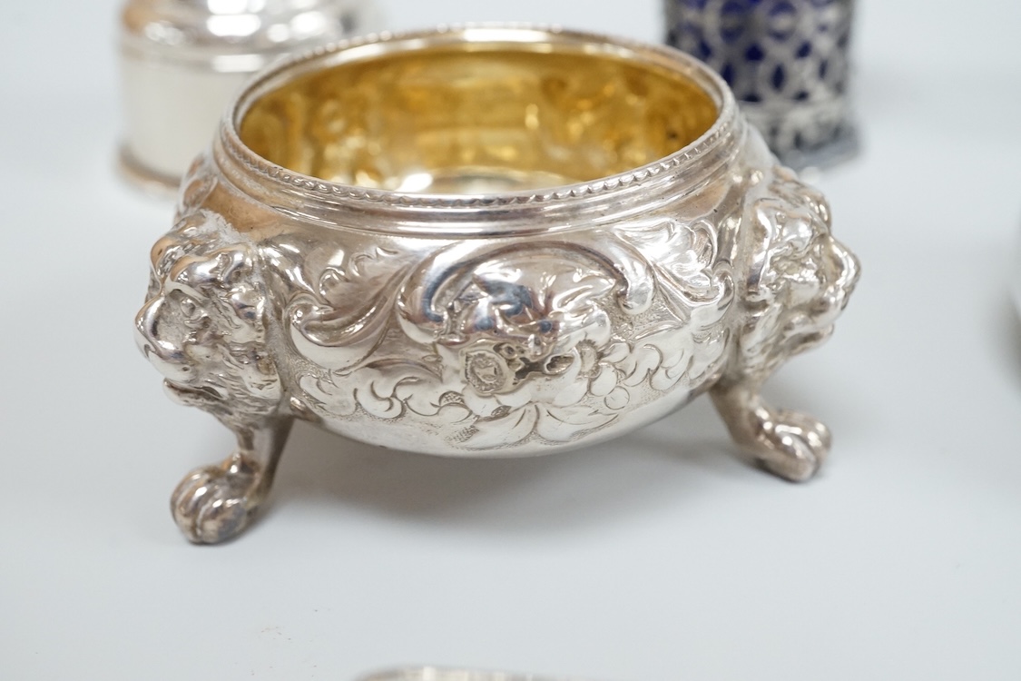 Four assorted silver condiments including a Victorian bun salt and a late Victorian pepper mill, together with a small silver bowl, a silver matchbox sleeve and a small silver two handled cup.